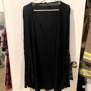 Torrid black long sleeve blouse with lace arm details from elbow to end.